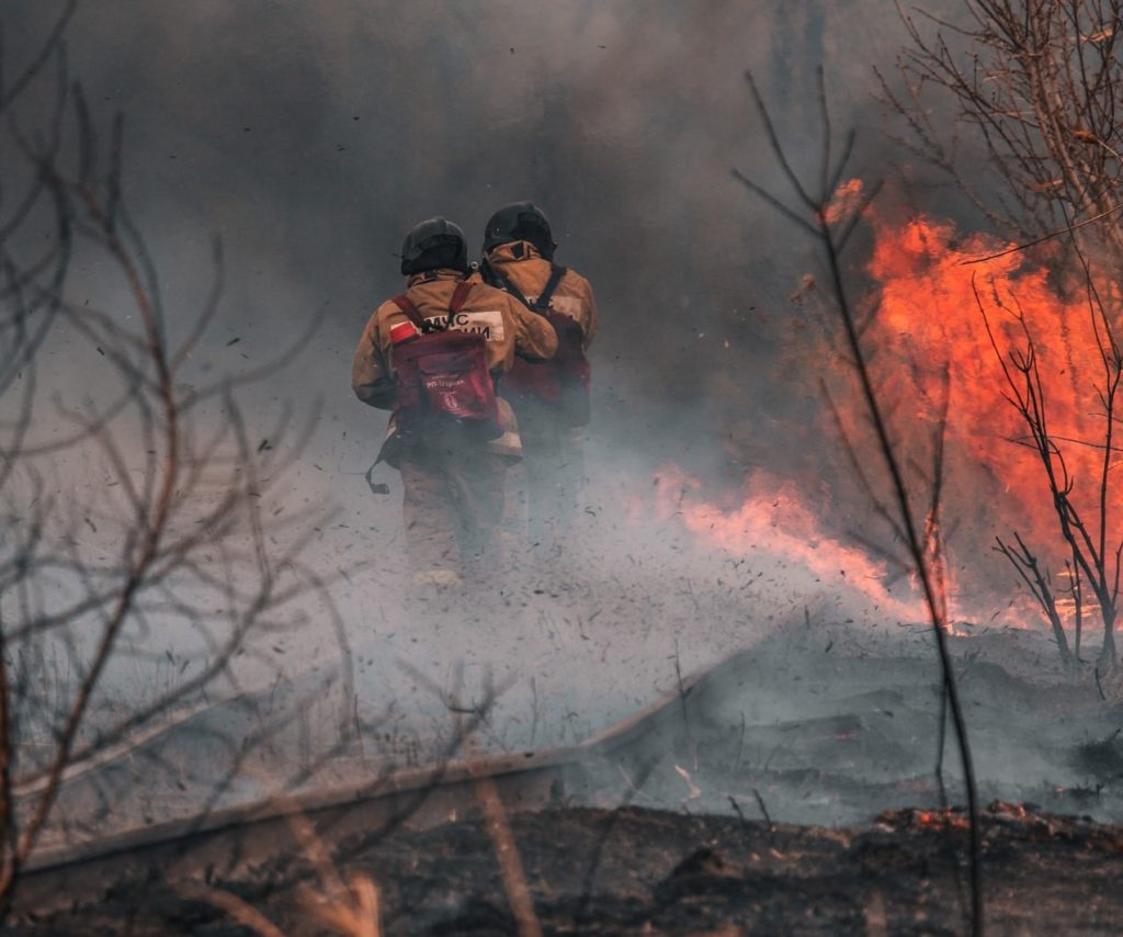 Fire Fighters Rush Into Burning Forest