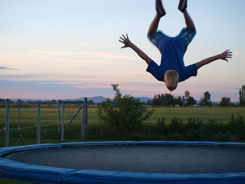 Kid Upside-Down on Trampoline