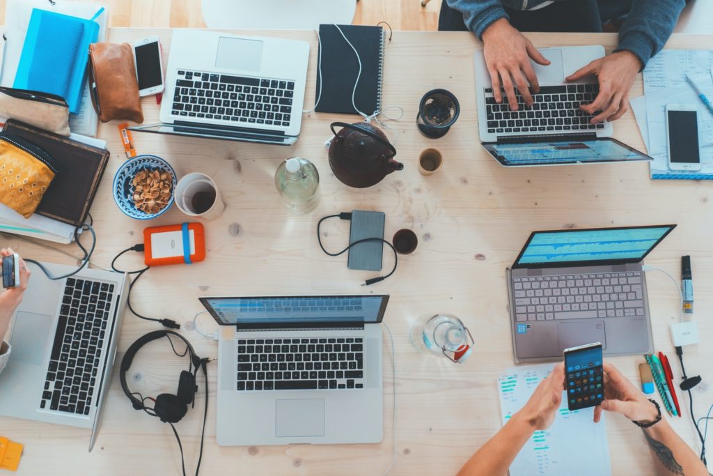 Desk Cluttered With Tech