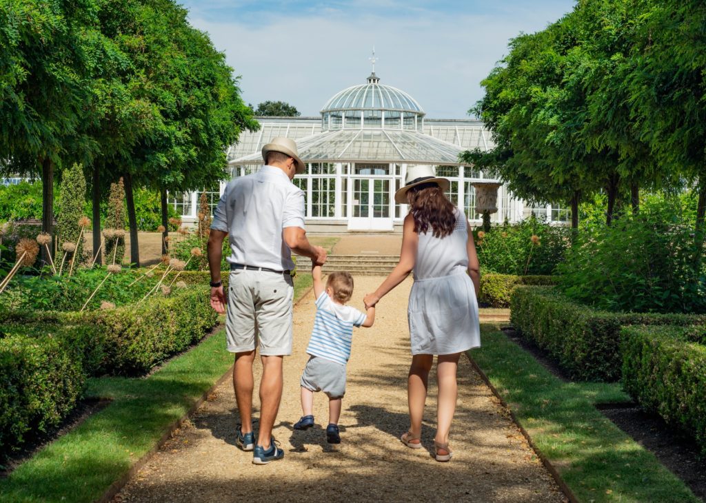 Family walking in a garden pavilion 